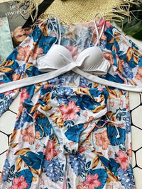 Купальник з тунікою plus size: білий ліф на кісточках і квітковий принт