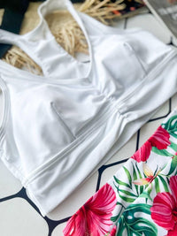 Роздільний купальник з топом-халтер і плавками з тропічним принтом